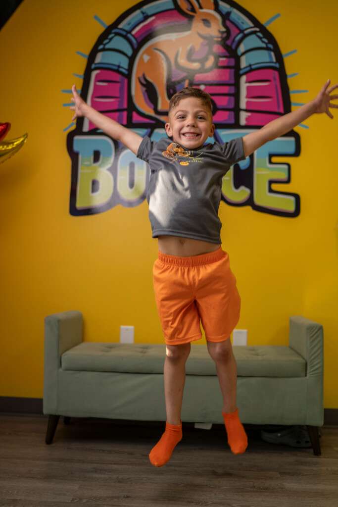 Boy jumping and having fun at Bounce Owasso